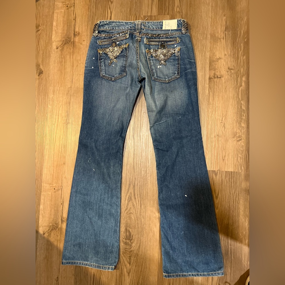 Vintage low rise jeans with button detail
